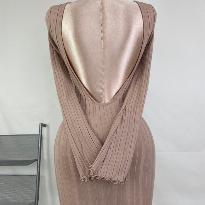 A fitted, ruffled edge knitted long dress