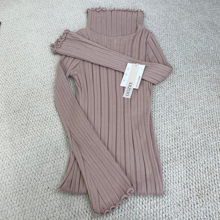 A fitted, ruffled edge knitted long dress
