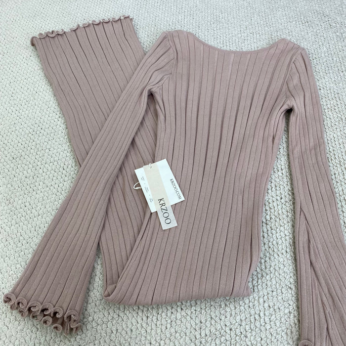 A fitted, ruffled edge knitted long dress