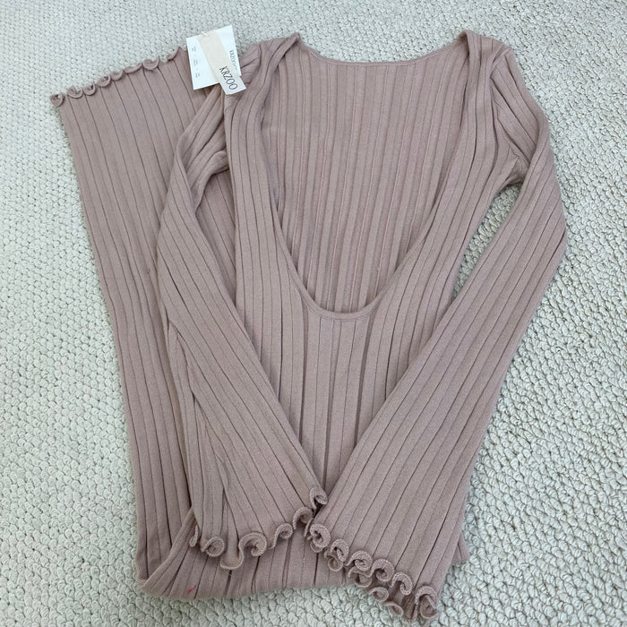 A fitted, ruffled edge knitted long dress