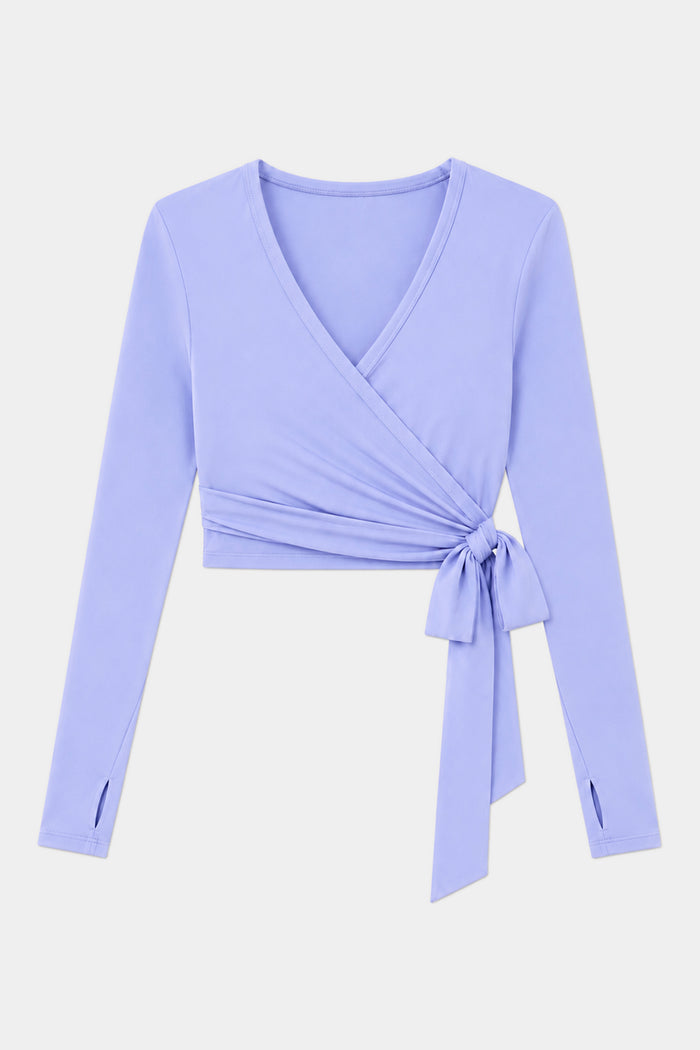 The SPLITS59 Bella Airweight Lite Wrap in Purple Haze features a V-neck, side tie, and long sleeves—perfect for Pilates or barre—shown against a plain white background.