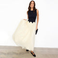 Black and Cream Monika Dress with a scalloped corset-style top and a pleated tulle mesh skirt.