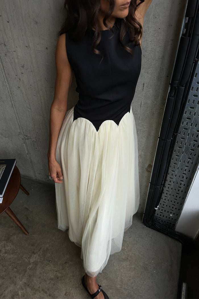 Black and Cream Monika Dress featuring a sleeveless corset top and a pleated tulle mesh midi skirt.