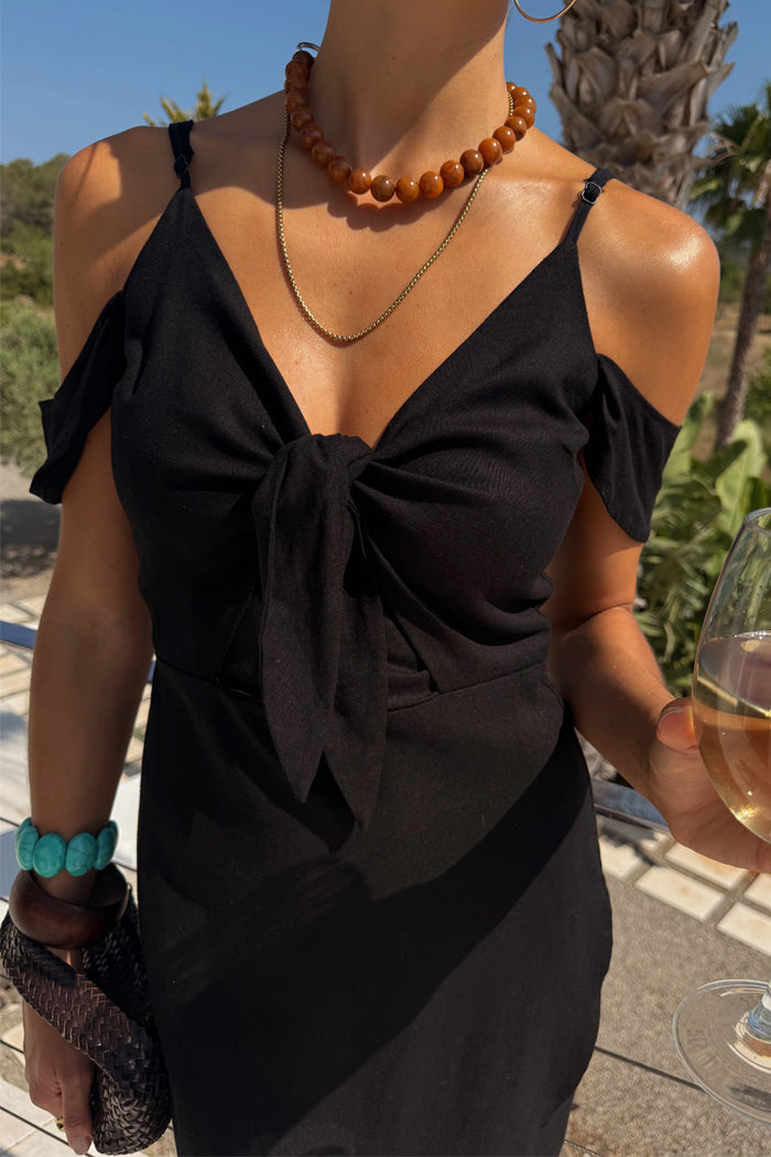 Black Cassie Dress featuring a tie-front bust and off-the-shoulder silhouette in a heavy linen blend.