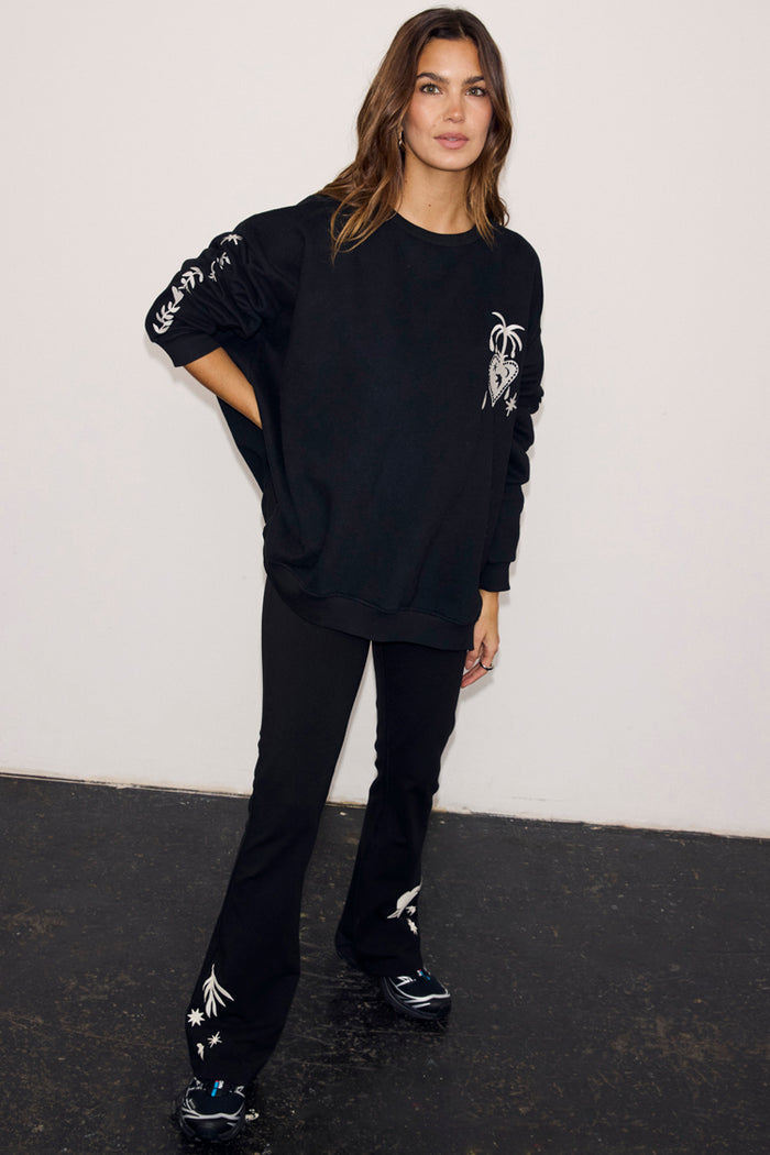 Black Cotton Wide Leg joggers with ecru embroidered motifs, paired with a matching sweatshirt for a casual co-ord.
