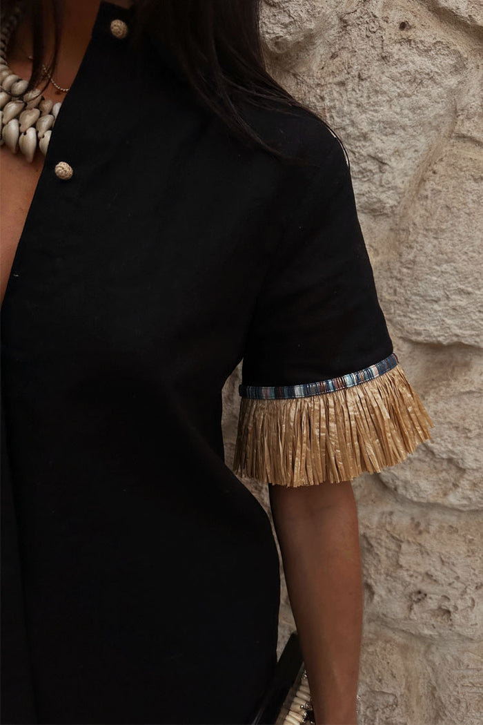 Black Raffia Shirt featuring tan raffia fringe on the sleeve and textured crochet shell-style buttons.