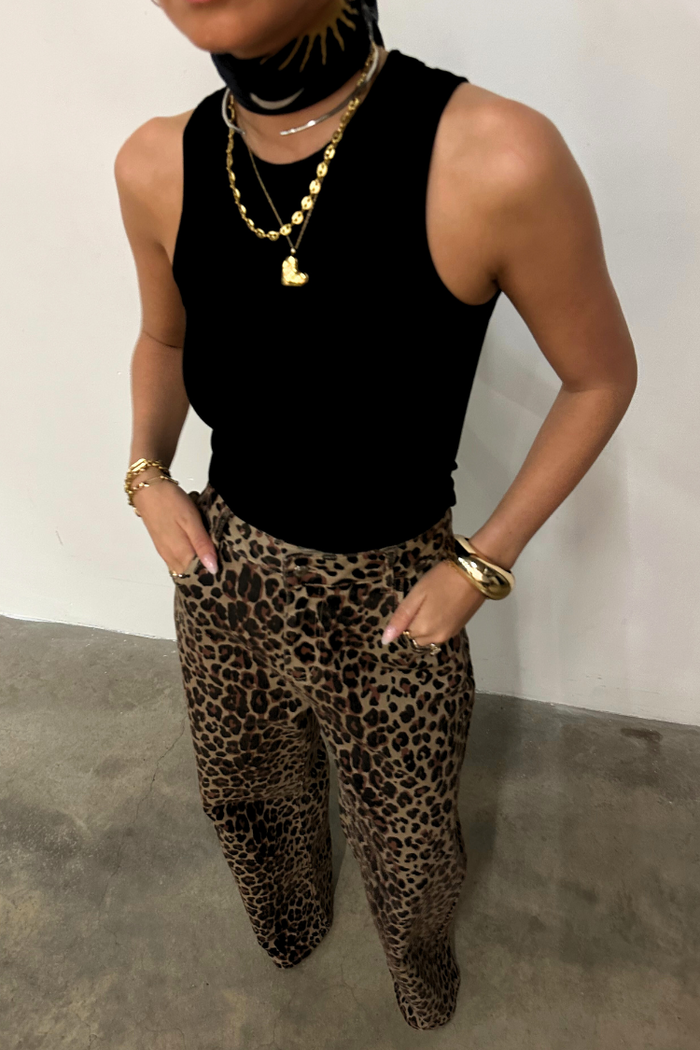 Black Ribbed Tank wardrobe staple styled with leopard print trousers and layered gold jewellery.