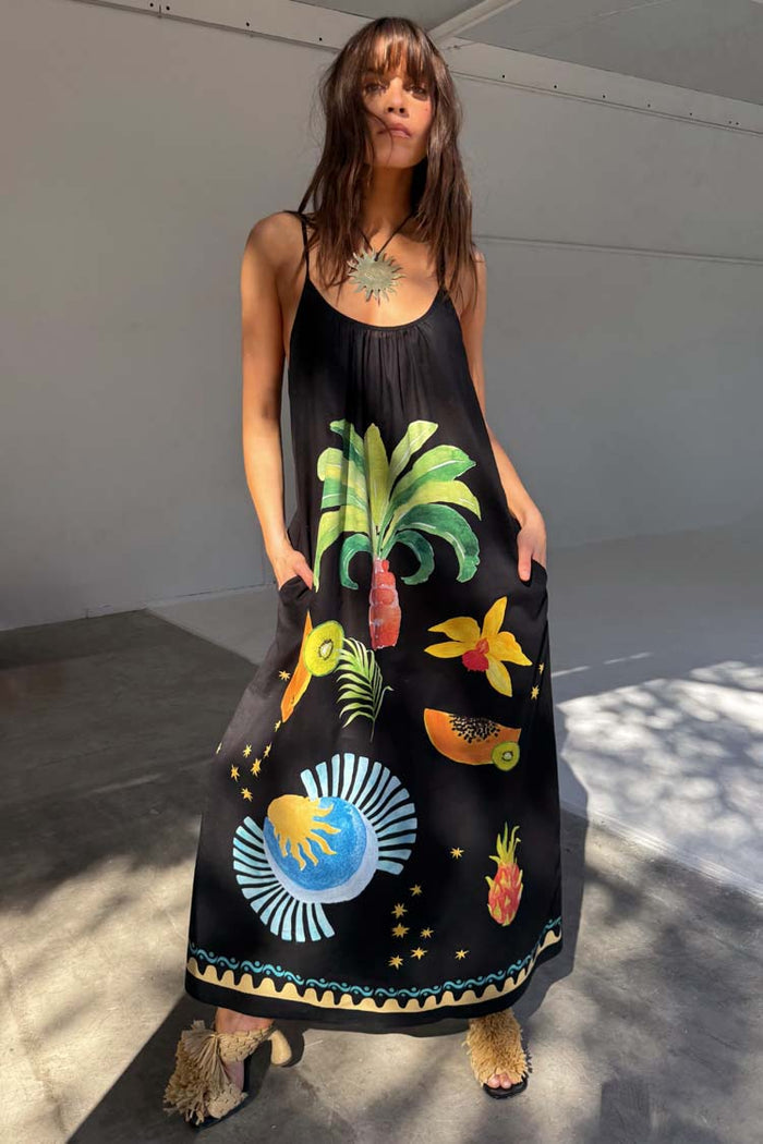 Black Rio Maxi Dress featuring hand-painted tropical fruit and palm motifs on a floor-length sleeveless silhouette.