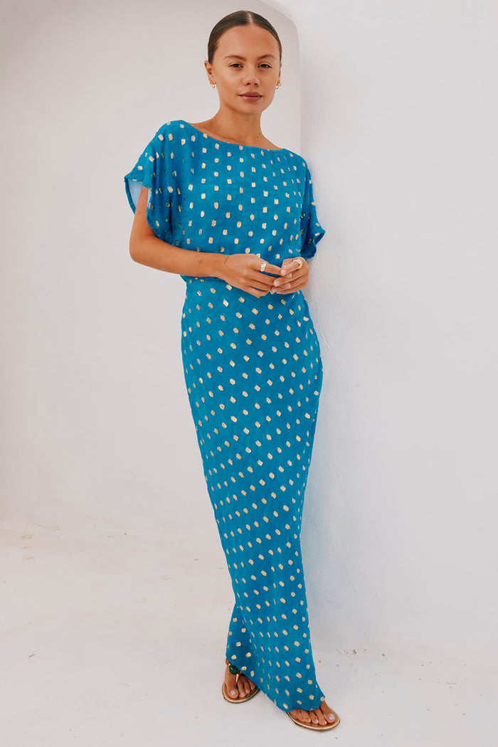 Blue Jacquard Tilly Dress featuring metallic gold dots and a versatile off-the-shoulder neckline.