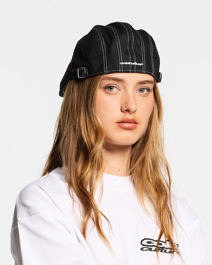 BONET BLACK - black contrast stitch flat cap, on model close-up - Cold Culture #woman