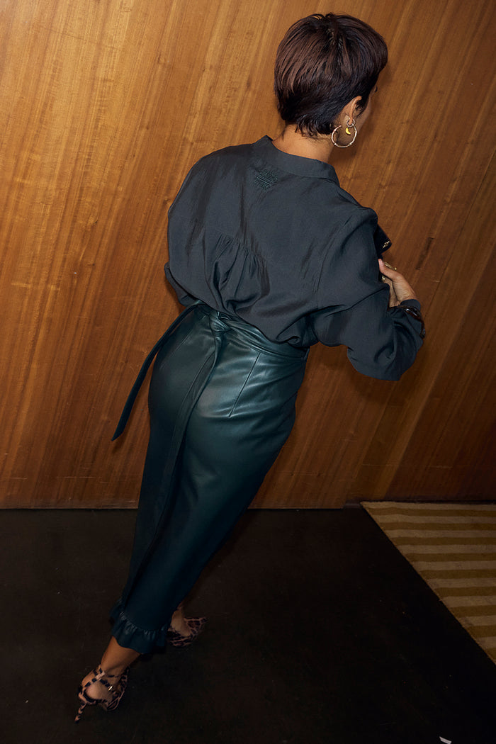 Bottle Green Ruffle Miley Shirt featuring an embroidered back neck logo and blouson sleeves, shown from behind.