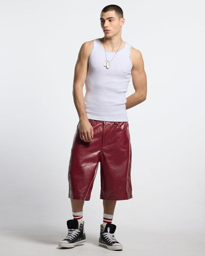 BRAVE SHORT BURGUNDY - burgundy perforated leather shorts, front view on male model - Cold Culture #man