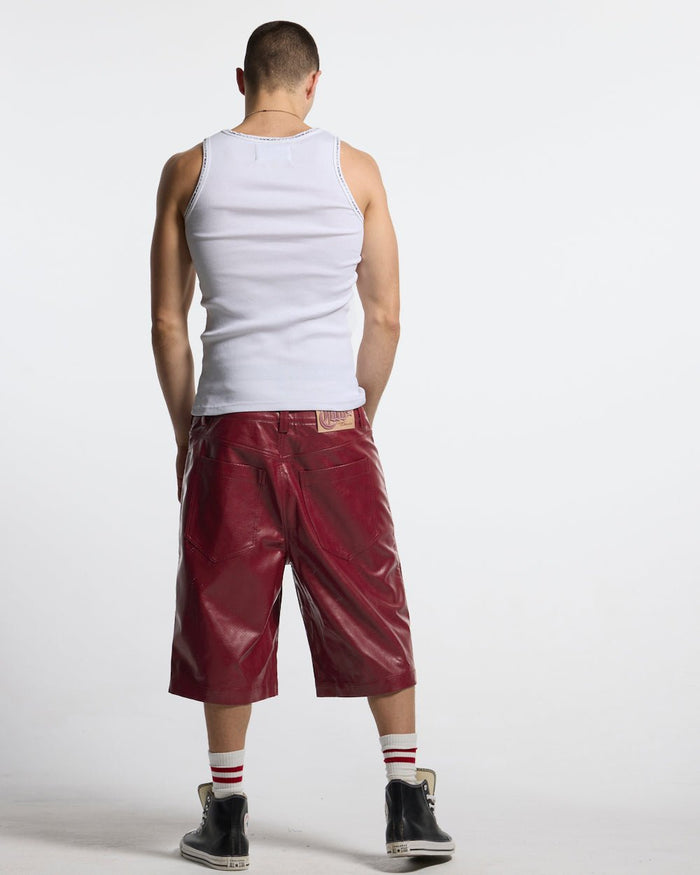 BRAVE SHORT BURGUNDY - burgundy perforated leather shorts, back view on male model - Cold Culture #man