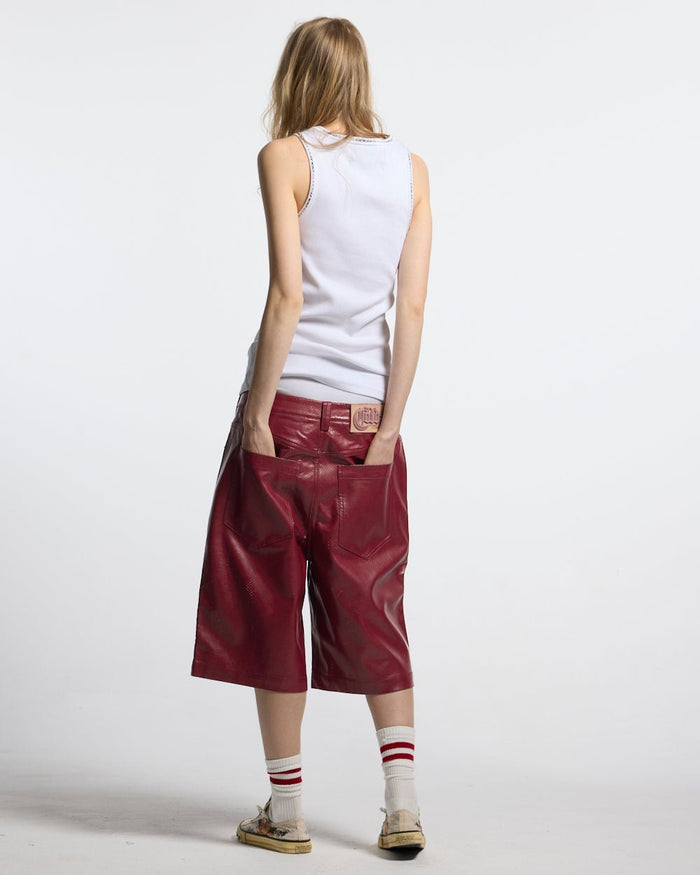 BRAVE SHORT BURGUNDY - burgundy perforated leather shorts, back view on female model - Cold Culture #woman