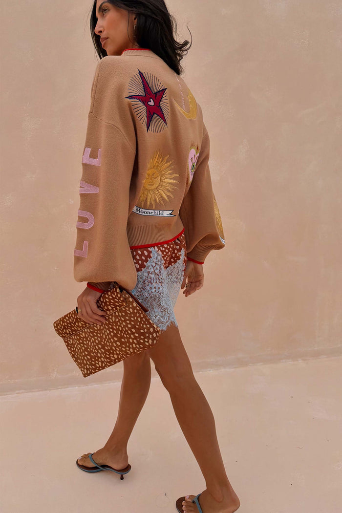 Camel Mystical Cardigan with gold and silver celestial embroidery and pink LOVE text on the sleeve.