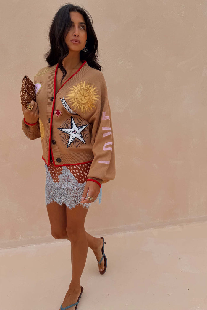 Camel Mystical Cardigan with sun and moon embroidery and red contrast trim.