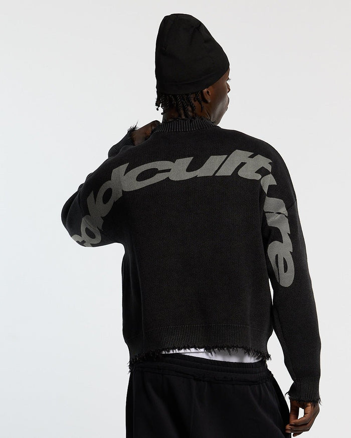 COZY CURVED KNITWEAR BLACK - black distressed knit sweater, back view on male model - Cold Culture #man
