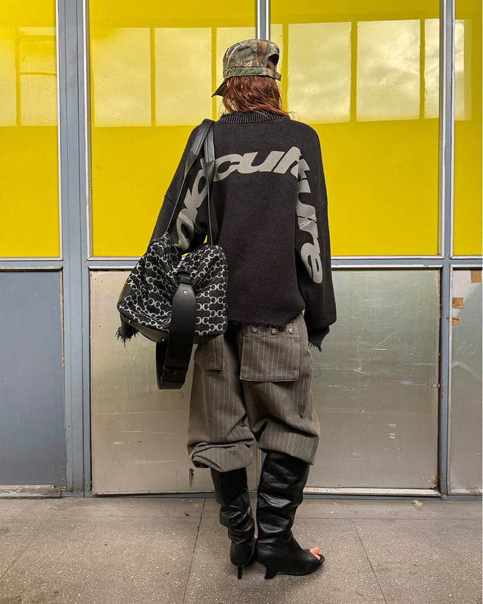 COZY CURVED KNITWEAR BLACK - black distressed knit sweater, street style shot - Cold Culture