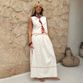 Cream and Red Pollenca Skirt in cotton with red blanket stitch detailing and an embroidered sun motif waistband.