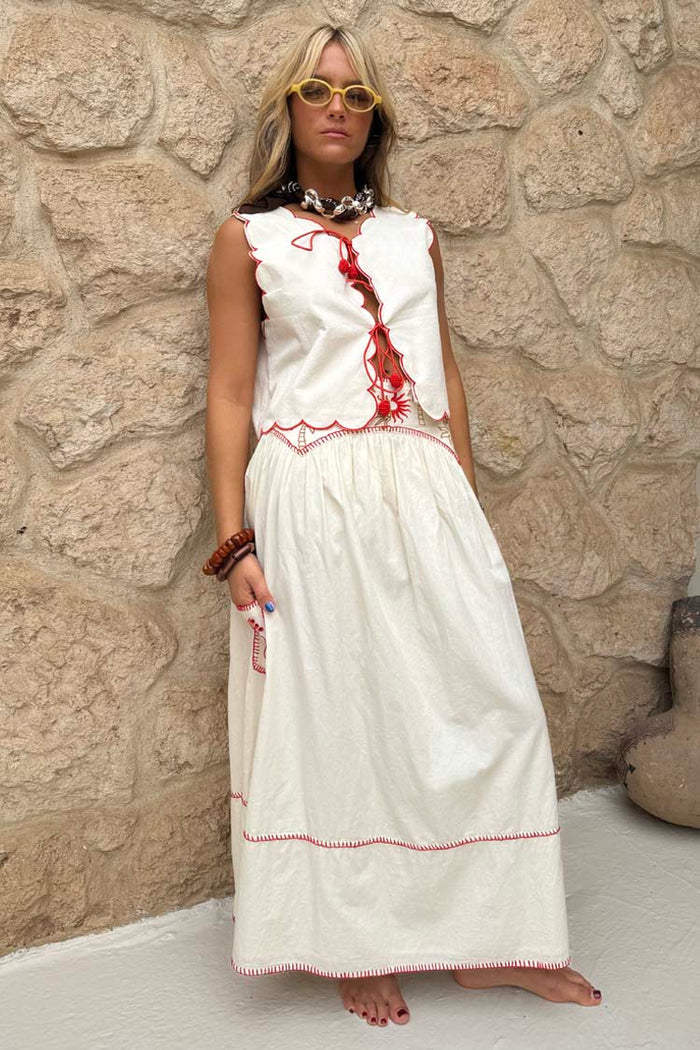 Cream and Red Pollenca Skirt in cotton with sun embroidery and blanket stitch, styled as a holiday co-ord.