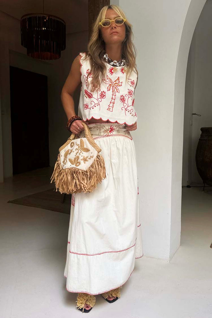 Cream cotton Pollenca Skirt featuring red palm motifs and blanket stitching, part of a vacation co-ord.
