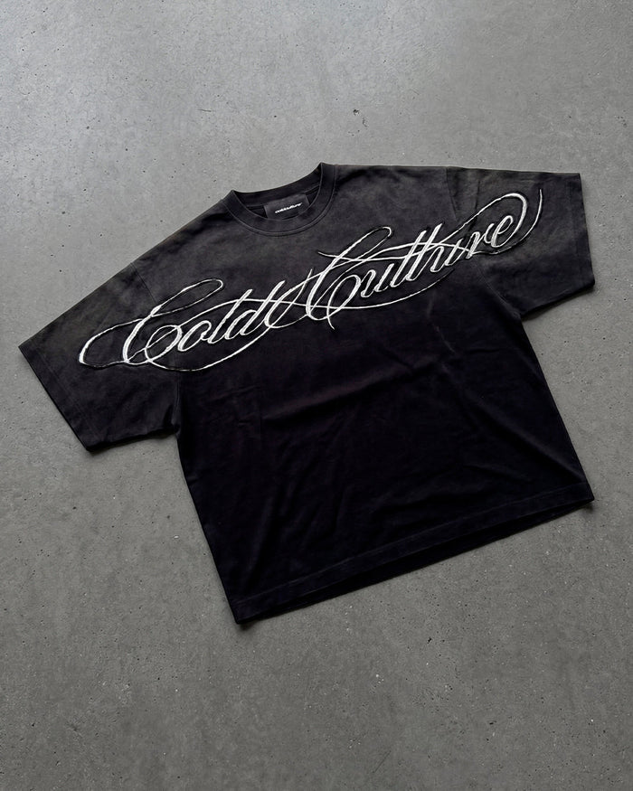 CROSSED SCRIPT TEE 2.0 BLACK - washed black script print tee, flat lay - Cold Culture