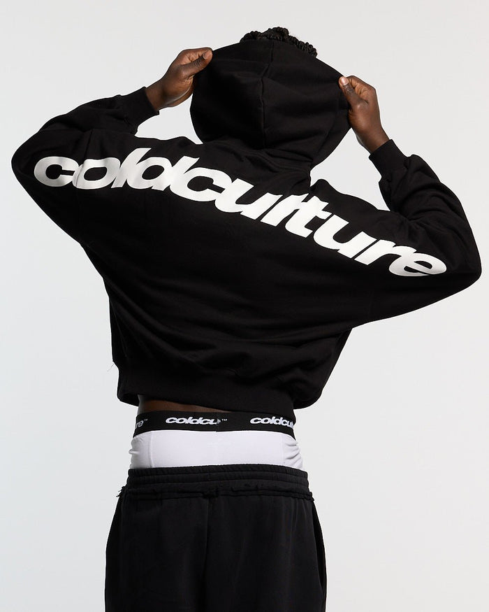 CURVED HOODIE BLACK AND WHITE - black oversized hoodie, back view on male model - Cold Culture #man