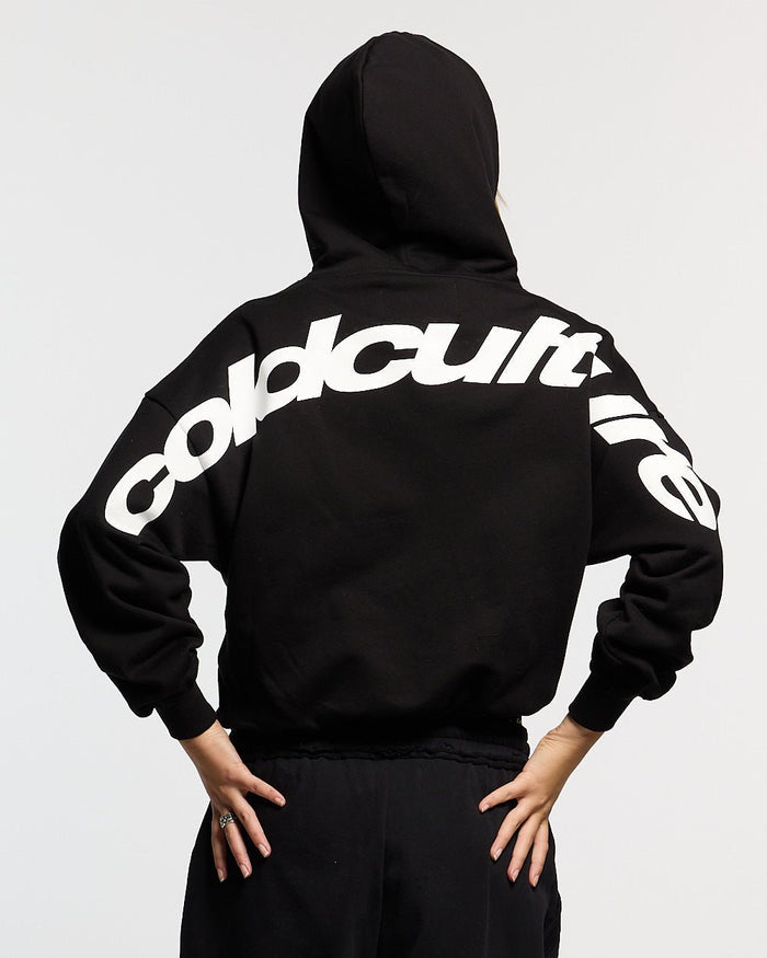 CURVED HOODIE BLACK AND WHITE - black oversized hoodie, back view on female model - Cold Culture #woman