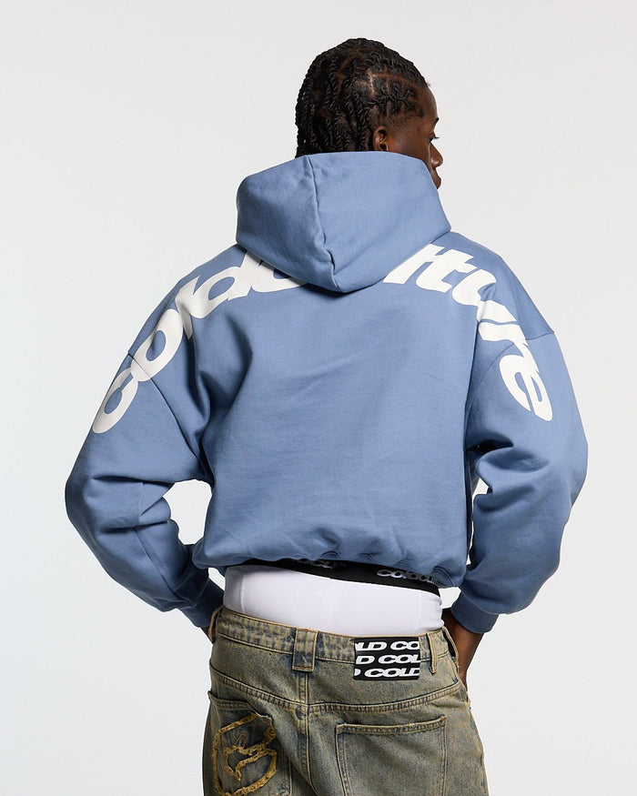 CURVED HOODIE LIGHT BLUE - light blue oversized hoodie, back view on male model - Cold Culture #man