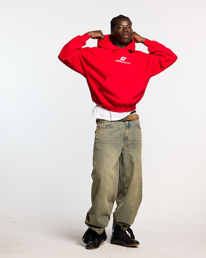 CURVED HOODIE RED - red oversized hoodie, front view on male model - Cold Culture #man