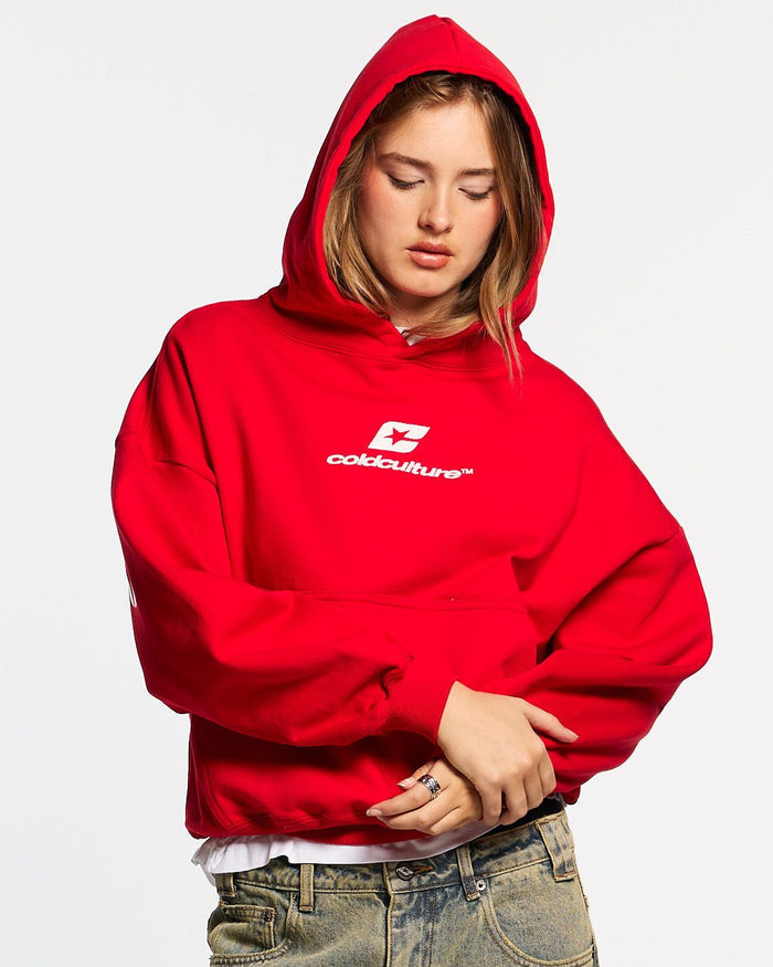CURVED HOODIE RED - red oversized hoodie, front view on female model - Cold Culture #woman