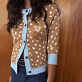 Deer Print Hollie Cardigan in beige and white with blue ribbed trims and an embroidered heart detail.