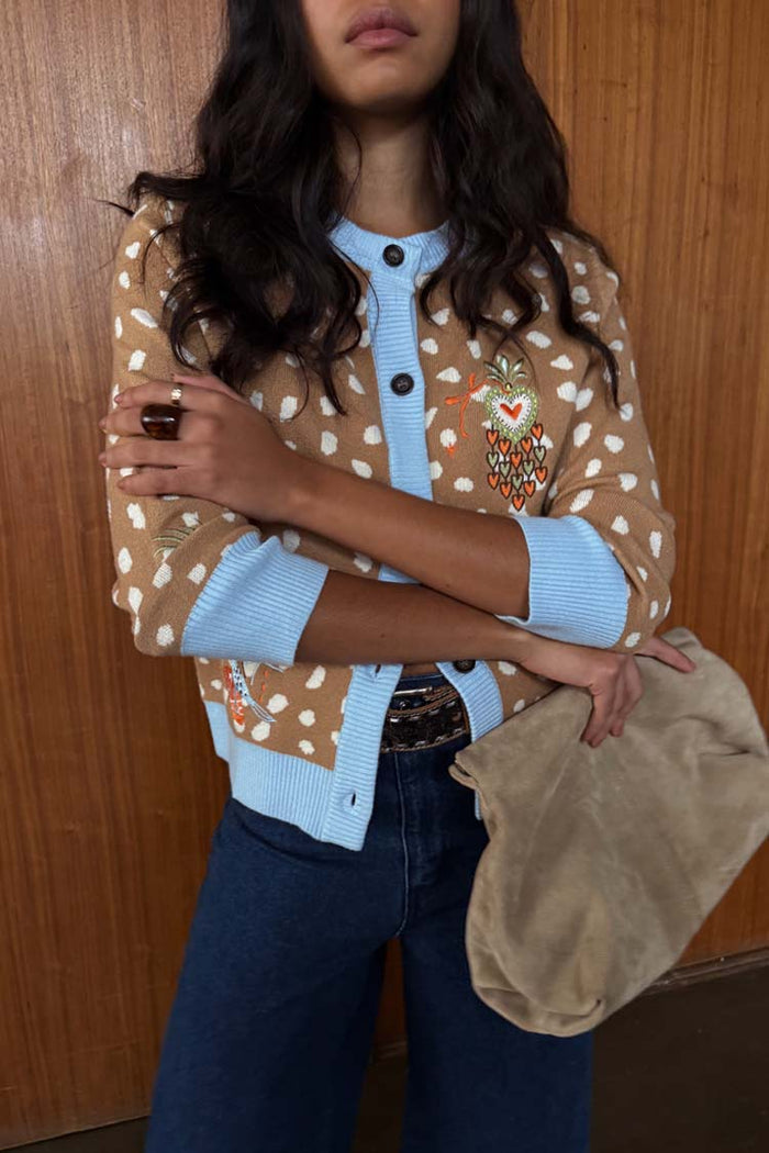 Tan Deer Print Hollie Cardigan with white spots and blue ribbed trims, featuring an embroidered heart detail.