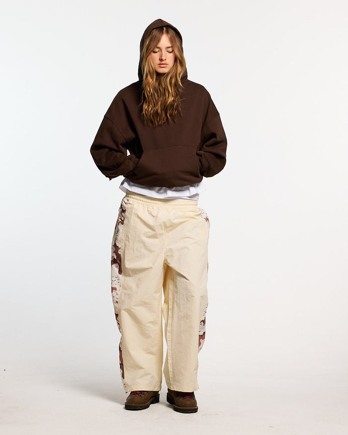 DISTRESS CURVED HOODIE BROWN - brown distressed hoodie, front view on female model - Cold Culture #woman
