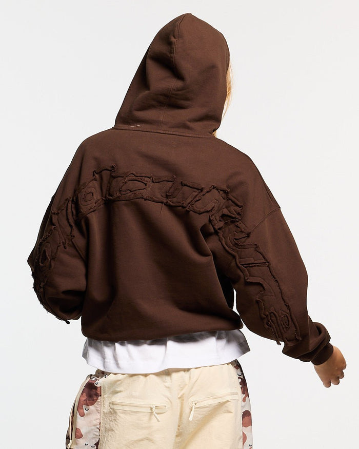 DISTRESS CURVED HOODIE BROWN - brown distressed hoodie, back view on female model - Cold Culture #woman
