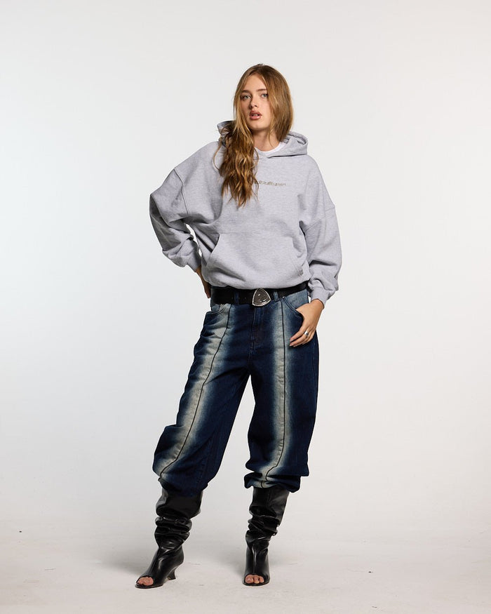 DISTRESS CURVED HOODIE LIGHT GREY - light grey distressed hoodie, front view on female model - Cold Culture #woman