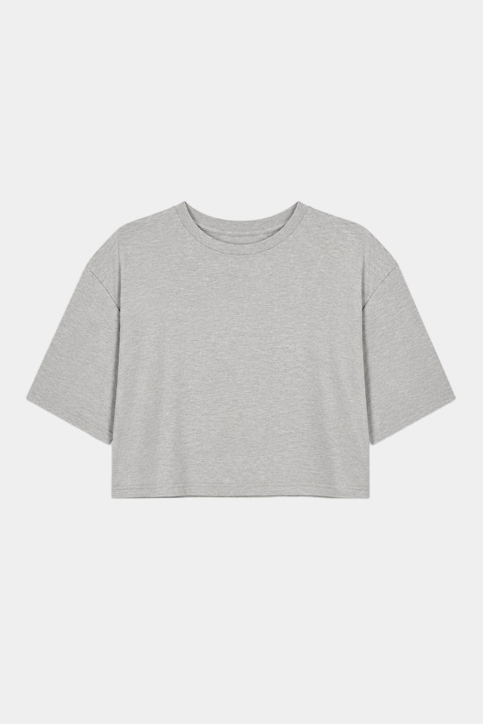 The SPLITS59 Djuna Oversized Crop Jersey Tee in Heather Grey, made from soft viscose, is a light gray short-sleeve cropped t-shirt laid flat on a white background.