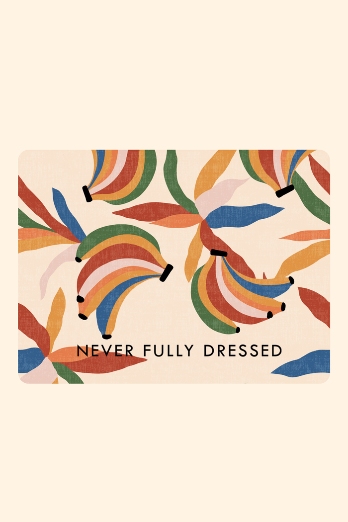 Never Fully Dressed e-Voucher featuring a vibrant multi-coloured banana print pattern on a cream background.