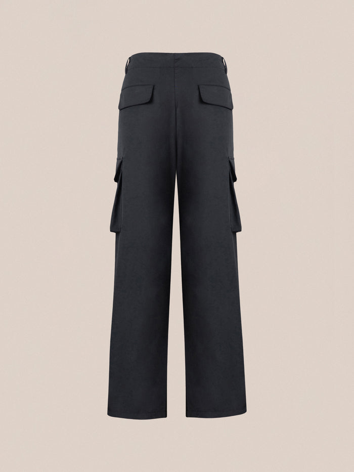 The back view of the black Elbas Cargo Pants with adjustable waist tabs by Found.