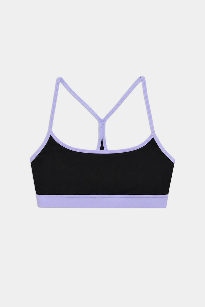 The SPLITS59 Emerson Airweight Bra in Black/Purple Haze features light purple trim and racerback straps, made from stretchy nylon spandex for comfort. Perfect for athletic wear, it's displayed on a plain white background.