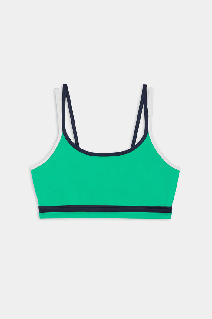 The SPLITS59 Eva Rigor Double Strap Bra in Spearmint/Indigo features thin indigo straps and a matching band along the bottom, shown on a white background.