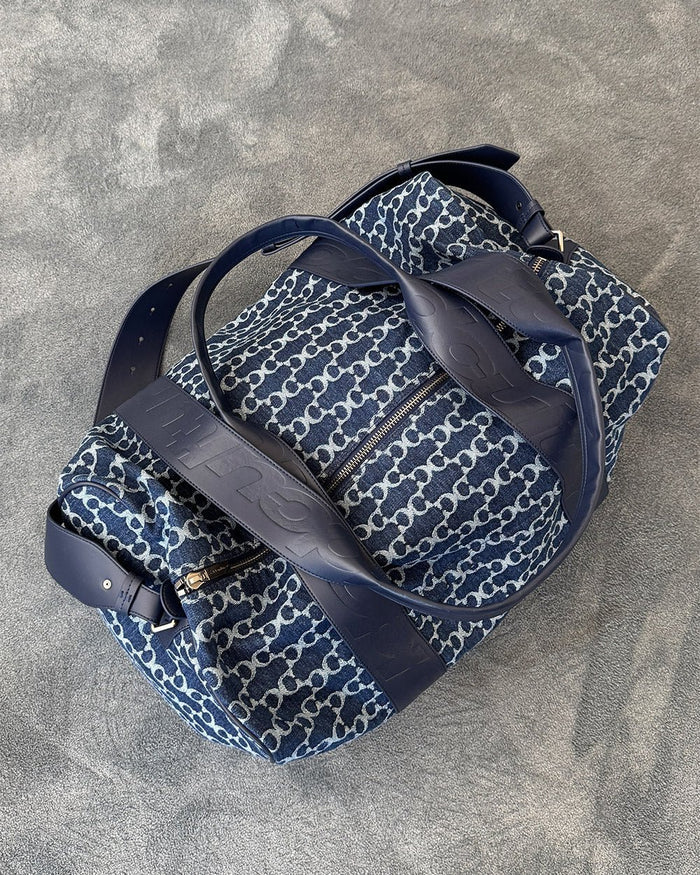 FEVER BAG BLUE - blue monogram duffle bag, flat lay - Cold Culture