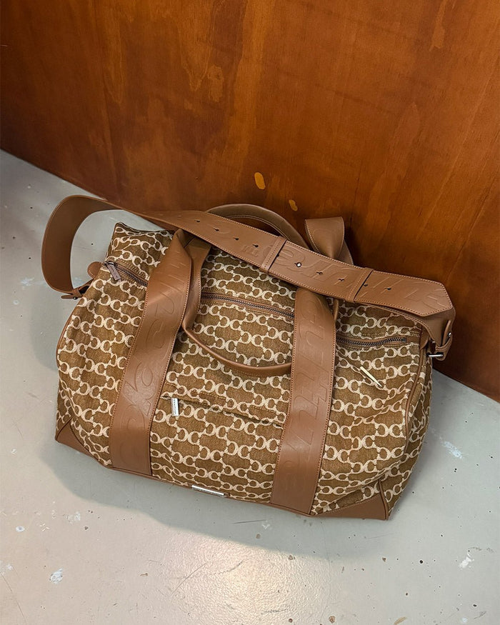 FEVER BAG BROWN - brown monogram duffle bag, front view - Cold Culture