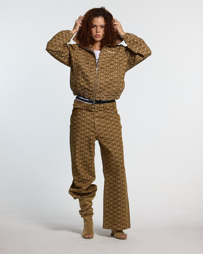 FEVER PANTS V3 BROWN - brown monogram denim pants, front view on female model - Cold Culture #woman