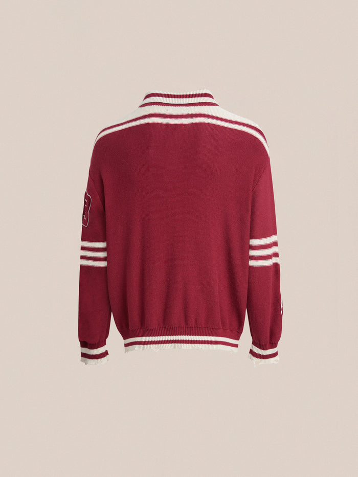 The back of a red sweater with white stripes features a Found Fin Varsity Patch Collared Cardigan.