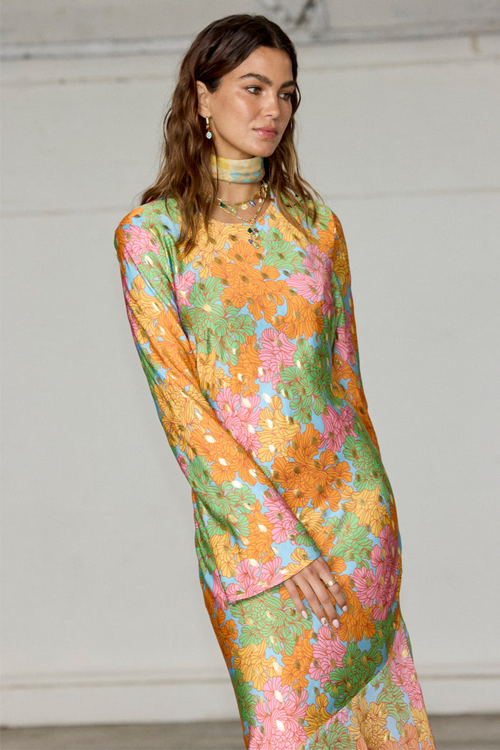 Floral Alaia Dress featuring a multicoloured floral print with gold flecks and subtle bell sleeves.