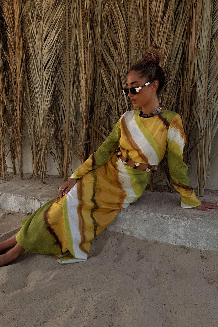 Green Ombre Alba Dress with a cut-out waist and stone beading in an earthy cotton-linen blend, styled for vacation.