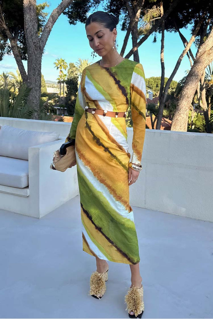 Green Ombre Alba Dress in earthy tones with long sleeves and a beaded cut-out waist, styled for vacation.