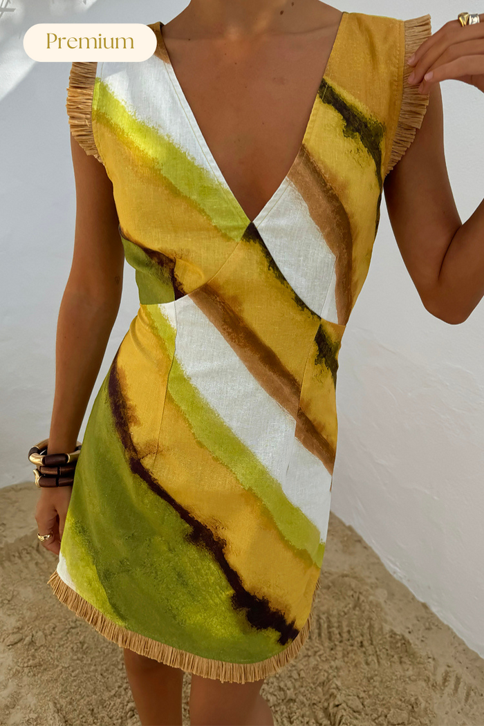 Green Ombre Deia mini dress with earthy green and yellow diagonal stripes and textured raffia trim.