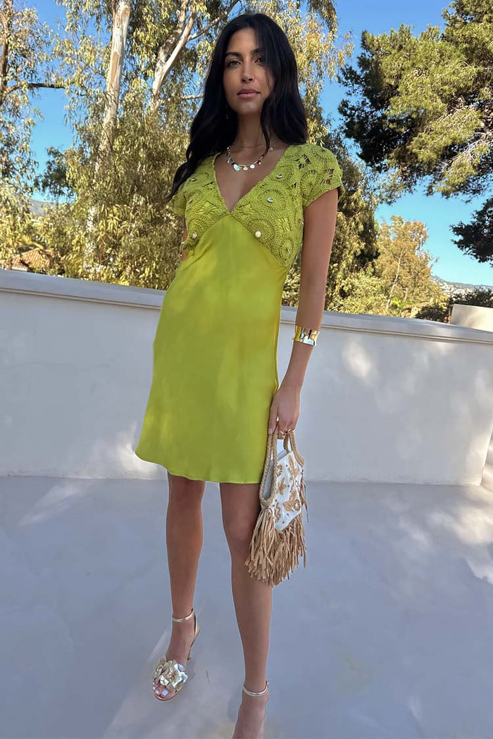 Green Shell Mini Elodie Dress in lime featuring a contrast crochet bodice and satin skirt.